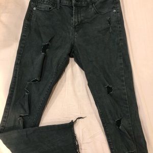 Black mid-rise ripped skinny jeans